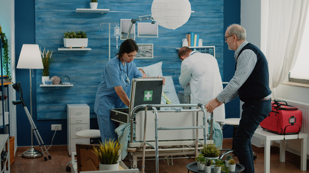 Worried man asking medical team to help sick old wife in nursing home. Doctor and nurse rushing to give assistance to ill retired patient hyperventilating, laying on hospital bed